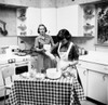 Two teenage girls preparing food in the kitchen Poster Print - Item # VARSAL25535484