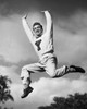 Portrait of a male cheerleader jumping and cheering Poster Print - Item # VARSAL2555055