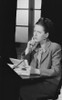 Young woman sorting by desk with documents and thinking Poster Print - Item # VARSAL255419621