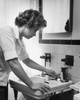 Side profile of a young woman cleaning the bathroom sink Poster Print - Item # VARSAL25541763