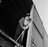 Low angle view of a senior man standing in a train car Poster Print - Item # VARSAL25544271