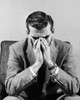 Close-up of a businessman sitting with his hands covering mouth Poster Print - Item # VARSAL2553061
