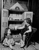 Girl playing with dollhouse Poster Print - Item # VARSAL255416934