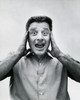 Portrait of a mid adult man suffering from a headache Poster Print - Item # VARSAL25512506