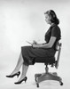 Side profile of a young woman writing on a notepad Poster Print - Item # VARSAL2557242B