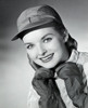 Portrait of a young woman smiling with her hands on her chin Poster Print - Item # VARSAL25541513
