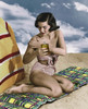 Young woman applying suntan lotion on beach Poster Print - Item # VARSAL25518814A