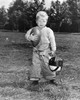 Portrait of a boy holding a football and a helmet Poster Print - Item # VARSAL2557299