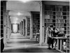 Two mid adult women reading a book in a library  University of Manchester  Manchester  England Poster Print - Item # VARSAL25518819