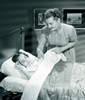 Mother with daughter sleeping in bed Poster Print - Item # VARSAL255417286