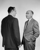 Two businessmen talking Poster Print