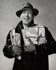 Portrait of a mid adult man holding Christmas presents and smiling Poster Print - Item # VARSAL25510469 Portrait of a mid adult man holding Christmas presents and smiling Poster Print - Item # VARSAL25510469