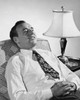 Mature man sitting in an armchair and smiling Poster Print - Item # VARSAL25549170