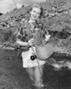 Portrait of young woman fishing Poster Print - Item # VARSAL255417928