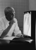 Doctor examining x-ray Poster Print - Item # VARSAL255419003