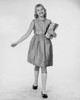 Schoolgirl holding books and smiling Poster Print - Item # VARSAL2556589B