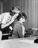 Side profile of a businesswoman whispering to another businesswoman in an office Poster Print - Item # VARSAL25527684
