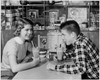 Side profile of a teenage couple drinking a milk shake in a restaurant Poster Print - Item # VARSAL2558611