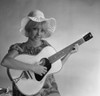 Studio portrait of young woman holding guitar Poster Print - Item # VARSAL255420923