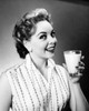 Portrait of a young woman holding a glass of milk Poster Print - Item # VARSAL25512670