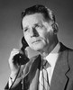 Mature businessman using telephone Poster Print - Item # VARSAL25548248
