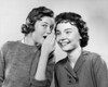 Portrait of a teenage girl whispering to another teenage girl Poster Print - Item # VARSAL25511108