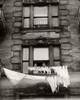 Low angle view two children looking at clothes hanging on clotheslines Poster Print - Item # VARSAL25515562