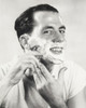 Portrait of a mid adult man shaving Poster Print - Item # VARSAL2553060