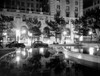 1930s Night Scene 5Th Avenue Tree Lined Sidewalk Cars Silhouetted Men Reflecting Water In Pulitzer Fountain Nyc Usa - Item # PPI178651LARGE