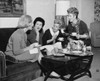Four young women sitting together drinking tea Poster Print - Item # VARSAL25518951A