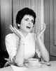 Young woman sitting with a tea cup gesturing Poster Print - Item # VARSAL25512655