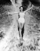 1950s Smiling Woman In White Two Piece Bathing Suit Aquaplaning Water Skiing Looking At Camera Print By Vintage - Item # PPI176460LARGE