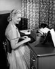 Side profile of a businesswoman typing a document on a typewriter Poster Print - Item # VARSAL25548465