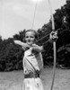 1930s Girl Wearing A Camp Jumper With Wide Leather Belt About To Release An Arrow From Bow Print By Vintage Collection - Item # PPI172395LARGE