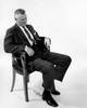 Studio shot of businessman sitting on chair Poster Print - Item # VARSAL25548972