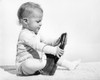 1960s Baby Boy Trying To Put On Adult Man'S Shoe Poster Print By Vintage Collection (22 X 28) - Item # PPI177360LARGE