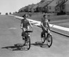 1950s Teen Boy Girl Couple Riding Bikes Down Residential Street Poster Print By Vintage Collection (32 X 36) - Item # PPI177175LARGE
