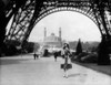 1920s Woman Walking Under The Eiffel Tower With The Trocadero In Background Paris France Print By Vintage Collection - Item # PPI172445LARGE