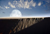 A larger than life depiction of the full moon rising above a sand dune at White Sands National Monument, New Mexico Poster Print - Item # VARPSTRIT100021S