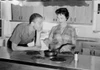 Young couple in kitchen Poster Print - Item # VARSAL255419205