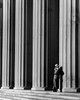 Businessman leaning against a column Poster Print - Item # VARSAL25548557