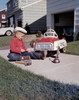 Boy repairing go-cart in yard Poster Print - Item # VARSAL255422665A