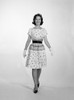 1960s-1950s Smiling Woman Walking To Looking At Camera Wearing Polka Dot Cotton Dress High Heel Shoes And White Gloves - Item # PPI179111LARGE