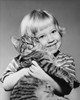 Close-up of a girl hugging a cat and smiling Poster Print - Item # VARSAL25550167