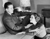 Young couple sitting in a living room Poster Print - Item # VARSAL2551037B