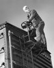 Low angle view of a brakeman standing on a freight car Poster Print - Item # VARSAL25540817