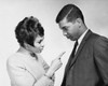 Side profile of a young woman pointing her finger at a young man Poster Print - Item # VARSAL25521678