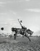 Cowboy riding bucking horse in rodeo Poster Print - Item # VARSAL25521957