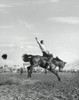 Cowboy riding bucking horse in rodeo Poster Print - Item # VARSAL25521957
