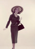 Studio portrait of young elegant woman carrying purse Poster Print - Item # VARSAL3844194